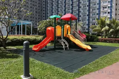 a playground with a slide in a park at Netflix, Destina Stays at Jazz Residences Makati, MetroManila in Manila