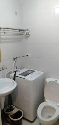 a bathroom with a toilet and a sink at Jazz Residences by Destina Stays, Makati, Metro Manila in Manila