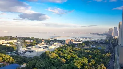an aerial view of a city with a river and buildings at StayInMyCondo - 8th Condo in Pasay near NAIA Airport, MOA Pasay in Manila