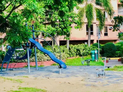 a playground with a blue slide in a park at Avida Tower Sucat, comfortable studio type in Manila