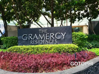 a sign for the germanagency reserves in front of flowers at the Gramercy Residences NEW RELEASE in Manila
