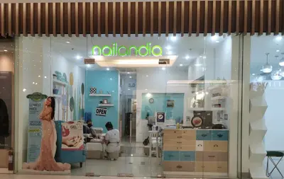 a nelvana store with people sitting in a room at Ethan's Pad Nr. BGC in Manila