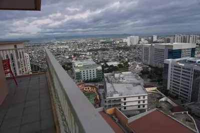 a view of a city from the balcony of a building at Premium Executive Suite at Venice Luxury Residences in Manila