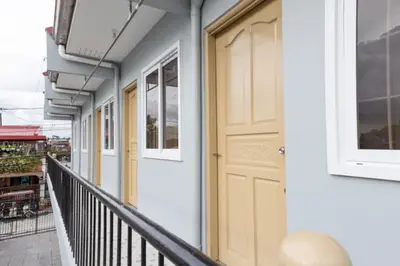 a door on the side of a building at Hive Manila Guesthouse -Netflix,400mbps WI-FI in Bacoor