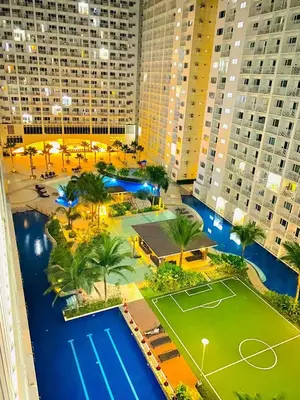 an aerial view of a tennis court in a city at Sweet Stays 888 in Manila
