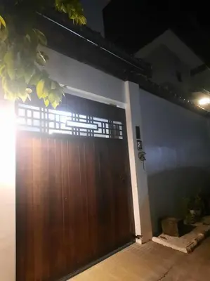 a large wooden garage door in a house at Omotenashi House of Santa Rosa City Laguna in Caingin
