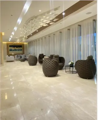 a lobby with couches and chairs in a building at MOA Pasay, Shore 3 Residences - Modern Luxury Condo in Manila