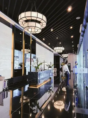 a lobby of a store with a person standing in it at Makati Cosy Home l Couples Families l 500Mbps Wifi in Manila