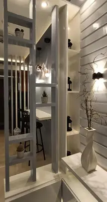 a living room with a vase on a table at LIGHT HOUSE ( MOA STAYCATION) in Manila