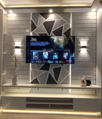 a flat screen tv on a wall in a living room at LIGHT HOUSE ( MOA STAYCATION) in Manila