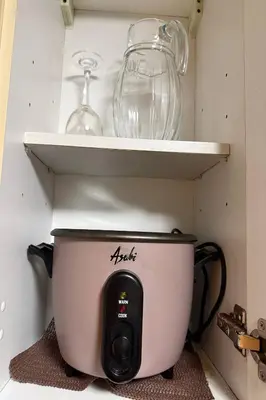 a pot on a shelf with a glass bowl on it at Del's Condotel across NAIA Terminal 3 in Manila
