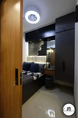 a living room with a couch and a mirror at DM's Place Family Suite B - Condo in Pasay in Manila