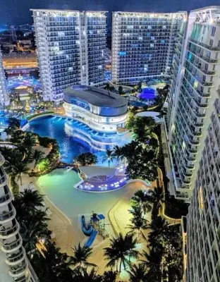 an aerial view of a resort with a water park at Azure south urban beach resort near airport in Manila