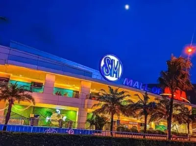 a building with a sign on the side of it at SHELL RESIDENCE c12 NEAR AIRPORT SHORWALK TO MALL OF ASIA in Manila