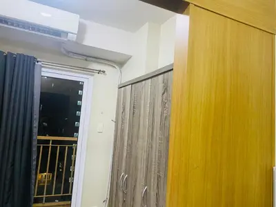 a room with a door and a window with a curtain at SHELL RESIDENCE c11 SHORWALK MALL OF ASIA & AIRPORT in Manila