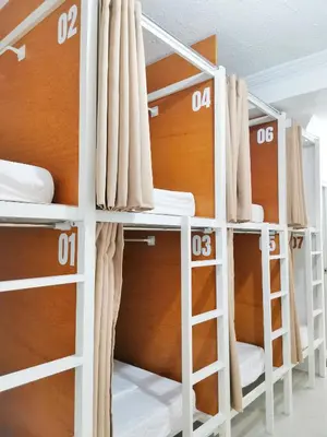 a group of bunk beds in a room at NomadsMNL Airport Hostel in Manila