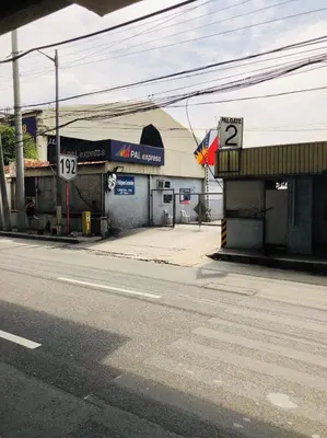 a gas station on the side of a street at THE MANSION: 18 PAX BUDGET NEAR AIRPORT TERMINAL PASAY in Manila