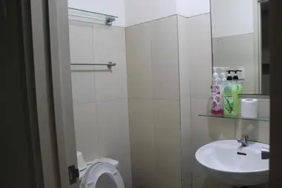 a bathroom with a toilet and a sink at CHATEAU ELYSEE a8 near Airport and Sm mall, WIFI in Manila