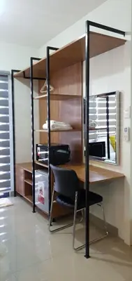 a room with a desk and a chair at Shore 2 residences condominium in Manila