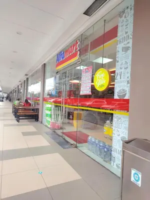 a fast food store with a large glass window at Shore Residence condotel,Pasay city Philippines in Manila