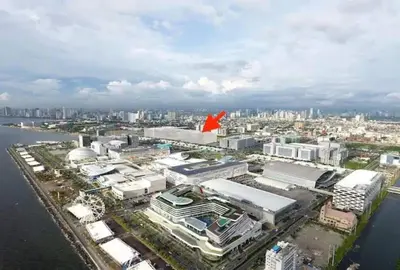 an aerial view of a city with a red flag at simple and affordable staycation at SHORE RESIDENCES in Manila