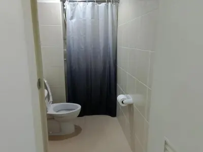 a bathroom with a toilet and a shower at Grand Riviera Suites, US Embassy Comfy, Affordable Studio in Roxas Blvd, Ermita Manila in Manila