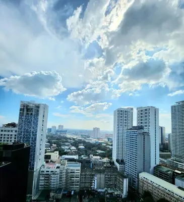 a view of a city with tall buildings at Modern Hotel-type Studio near Greenbelt Netflix 100mbps in Manila