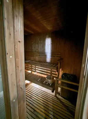 an inside view of a wooden sauna at Modern Hotel-type Studio near Greenbelt Netflix 100mbps in Manila