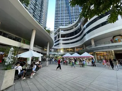a group of people sitting outside of a building at Muji-Inspired hōme-tél in the heart of Makati in Manila