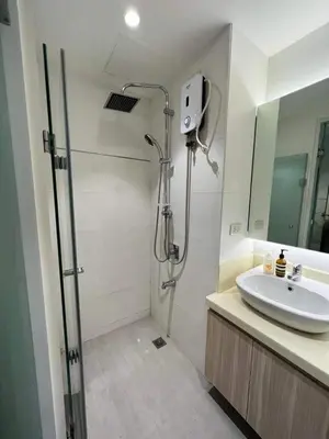 a bathroom with a shower and a sink at US Embassy Roxas Blvd, Ermita, Manila 1 Bedroom ComfySuite in Manila