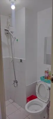 a bathroom with a toilet and a shower at JJMC HOMESTAY 36 With Netflix and Unli Wifi in Manila
