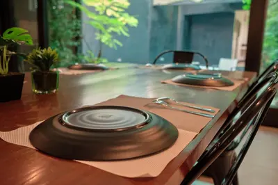 a wooden table with a vinyl record on top of it at Tropical Poolhouse QC in Manila