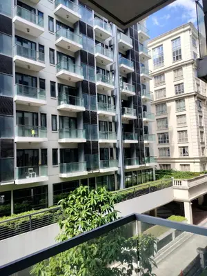 an apartment building seen from the balcony of a building at CondoTel Pasay Newport City in Manila