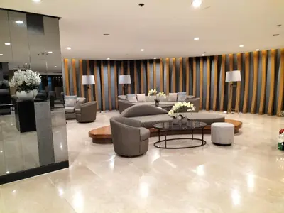 a lobby with couches and a table in a building at Cozy22 1BR at Shore2 Tower2 in Manila