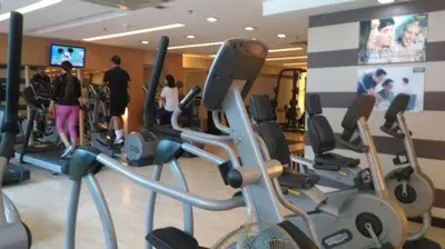 a gym with a bunch of exercise bikes in it at Family Staycation with Pool in Manila