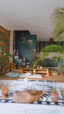a living room with a couch and a table at Boho Inspired Home Near Rockwell in Manila