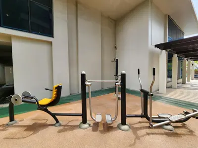 a group of exercise equipment in front of a building at 7 BGC Shopping Haven Steps Away from Uptown Mall and Mitsukoshi Mall FREE Parking with Washer in Manila