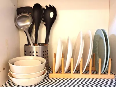 a group of utensils in a holder on a counter at Best staycation at Shell residences in MOA complex in Manila