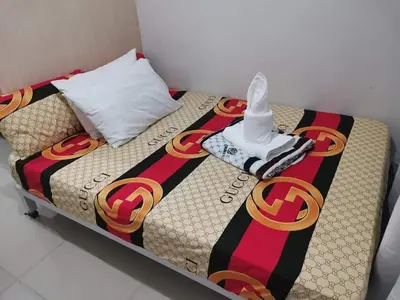 a bed in a room with at Sea Residences Staycation Tanya's Condo Pasay in Manila