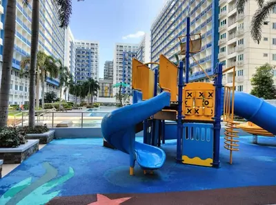 a playground in a city with a slide at Sea Residences Staycation by TVANS CONDOTEL Pasay City in Manila