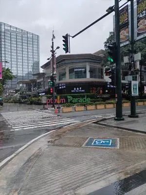 an empty street in a city with a traffic light at One Uptown Opposite of grandhyatt hotel manila Taguig city in Manila