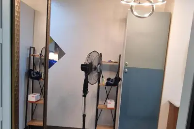 a room with a fan and a mirror at 1 Bed Apartment Sleeps 2 with Parking in Manila