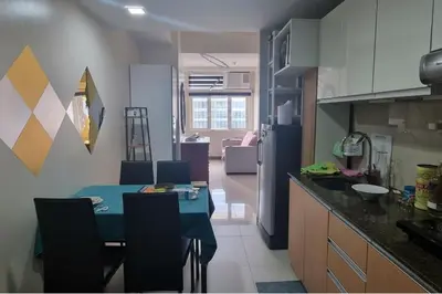 a kitchen with a blue table in a kitchen at 1 Bed Apartment Sleeps 2 with Parking in Manila