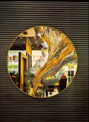 a painting in a circle on a wall at Air Residences Condominium Deluxe in Manila