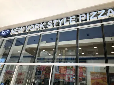 a building with a sign that reads new york style pizza at Robles’ Unit at 81 Newport Boulevard in Manila