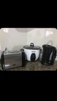 a slow cooker and a toaster sitting on a counter at Robles’ Unit at 81 Newport Boulevard in Manila