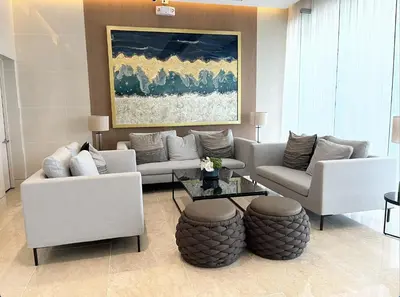 a living room with two couches and a table at Shore 3 Residences, Tower 1 Mall of Asia Complex, Pasay City, Metro Mania in Manila