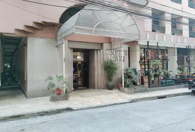 a store front of a building with a sign on it at Sunette Tower Makati in Manila
