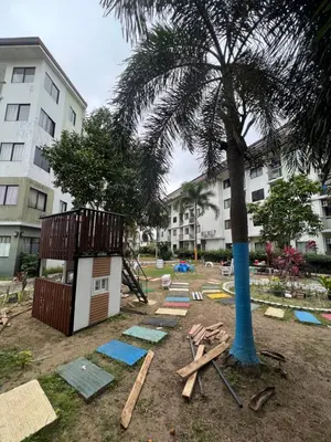 a building site with a palm tree and a building at Dream Condo in Santa Rosa in Santa Rosa