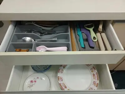 a drawer filled with dishes and utensils at Azure Urban Resort with WIFI and Netflix in Manila